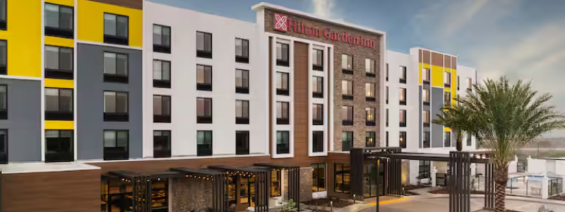 A render of the Merced Hilton Garden Inn during the daytime