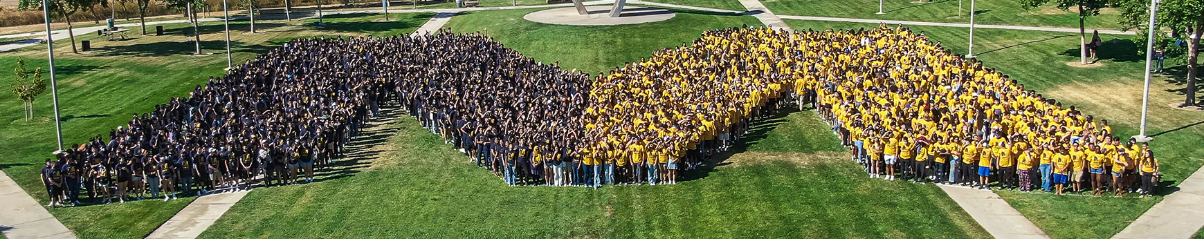uc merced students standing in the quad in the shape of an M to represent UC Merced
