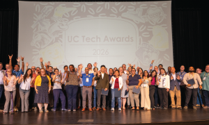 UC Tech Award Winners Celebrating on Stage.