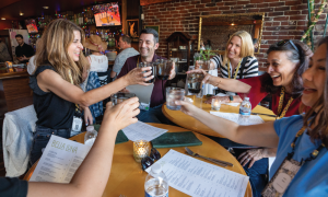 UC Tech Attendees enjoying a drink together.