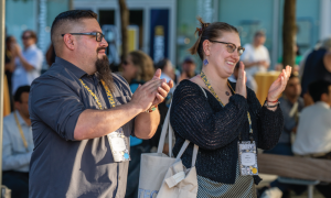 UC Merced's Gabe Edwards & Katie Adams Arca clapping during opening remarks.