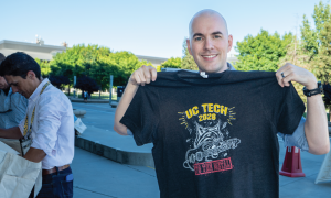 A UC Tech Attendee rocking out with their UC Tech 2026 shirt. 