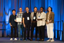 UC Tech 2025 Golden Design Award winners posing with UC CIOs at the UC Tech Award Ceremony.