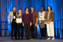 The UC Tech 2025 Gold Award winners for IT Security posing with UC CIOs at the UC Tech Awards Ceremony.