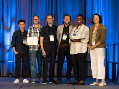 UC Tech 2025 Golden Design Award winners posing with UC CIOs at the UC Tech Award Ceremony.