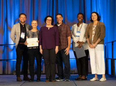 The UC Tech 2025 Gold Award winners for IT Security posing with UC CIOs at the UC Tech Awards Ceremony.